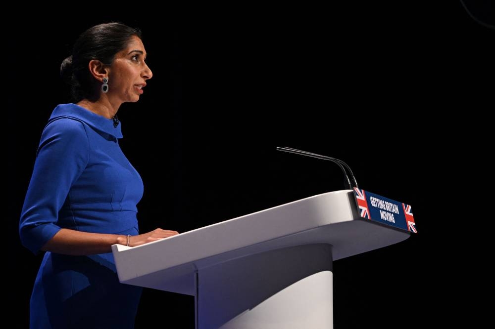 Britain's Home Secretary Suella Braverman addresses delegates on the third day of the annual Conservative Party Conference in Birmingham, central England, on October 4, 2022. — AFP pic