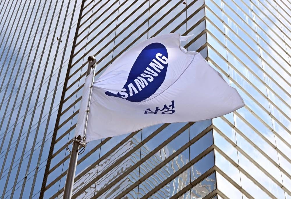 A Samsung flag flutters outside the company's Seocho building in Seoul October 7, 2022, after Samsung Electronics expected operating profits in the third quarter to fall 31.7 per cent. ― AFP pic