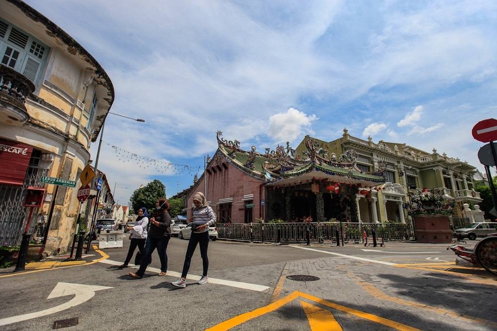 Tourists are seen at the art district of Armenian Street in George Town. — Picture by Sayuti Zainudin