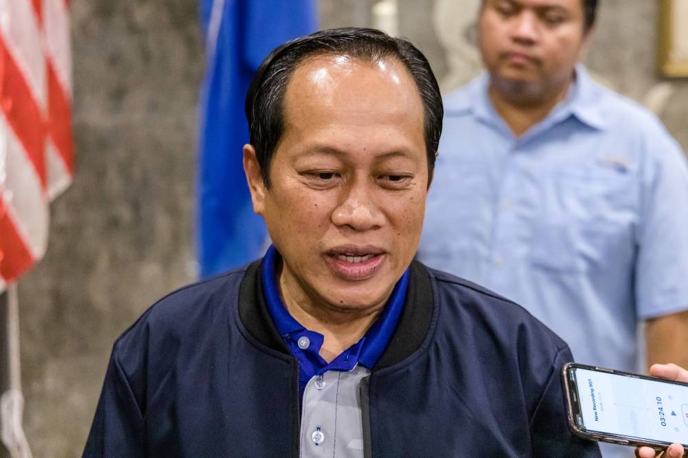 Umno secretary-general Datuk Seri Ahmad Maslan speaks to the media after the Umno meeting at Umno’s headquarters in Kuala Lumpur on October 6, 2022. ― Picture by Firdaus Latif
