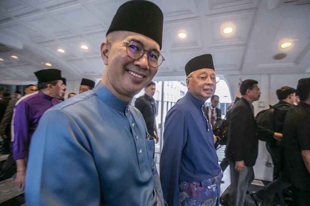 Finance Minister Datuk Seri Tengku Zafrul Abdul Aziz (left) and Prime Minister Datuk Seri Ismail Sabri Yaakob (right) after tabling Budget 2023 at Parliament session October 7, 2022. - Picture by Hari Anggara 