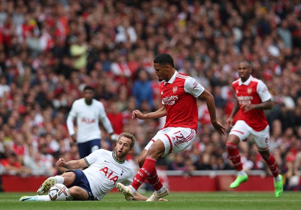 Tottenham Hotspur striker Harry Kane tackles Arsenal defender William Saliba during the English Premier League match between Arsenal and Tottenham Hotspur at the Emirates Stadium in London, October 1, 2022. — AFP pic 