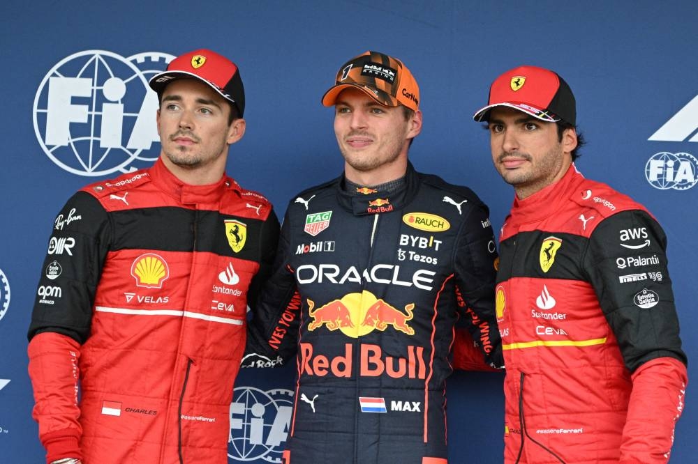 Pole position winner Red Bull Racing’s Dutch driver Max Verstappen (centre) poses with second-placed Ferrari’s Monegasque driver Charles Leclerc (left) and third Ferrari’s Spanish driver Carlos Sainz Jr after the qualifying session ahead of the Formula One Japanese Grand Prix at Suzuka, Mie prefecture on October 8, 2022. — AFP pic