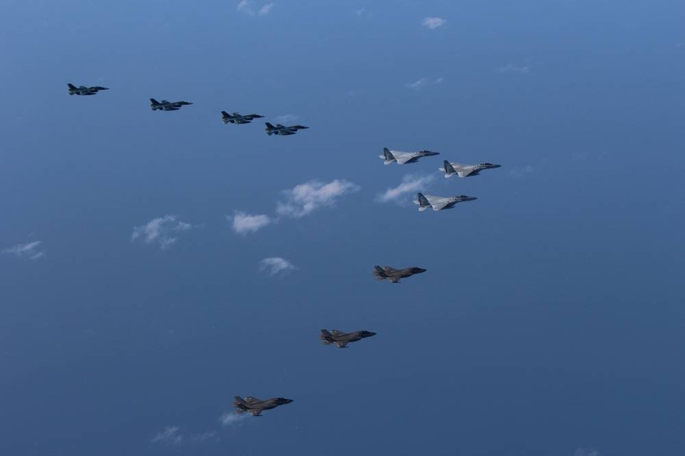 5th and 8th Air Wing of Japan Air Self-Defence Force's F-15 and F-2 fighters hold a joint military drill with US Marine Aircraft Group 12’s F-35B fighters off Japan’s southernmost main island of Kyushu, Japan, in this handout picture taken by Japan Air Self-Defence Force and released by the Joint Staff Office of the Defence Ministry of Japan October 4, 2022. — Reuters pic