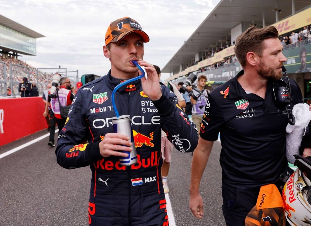 Red Bull’s Max Verstappen has a drink after qualifying in pole position for the Japanese Grand Prix at the Suzuka Circuit in Suzuka, Japan, October 8, 2022. — Reuters pic