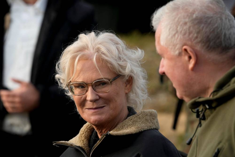 German Defence Minister Christine Lambrecht and Lithuanian Defence Minister Arvydas Anusauskas attend a NATO enhanced Forward Presence German-led battle group military exercise, near Rukla, Lithuania October 8, 2022. — Reuters pic