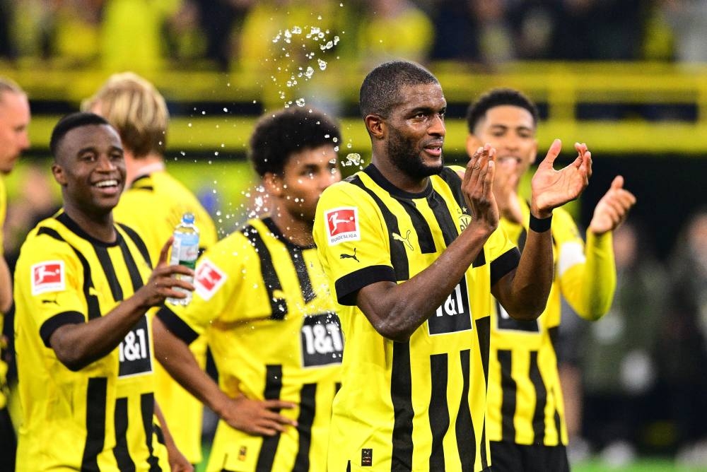 Borussia Dortmund's Anthony Modeste celebrates with teammates after the match against Bayern Munich at the Signal Iduna Park, Dortmund October 8, 2022. — Reuters pic