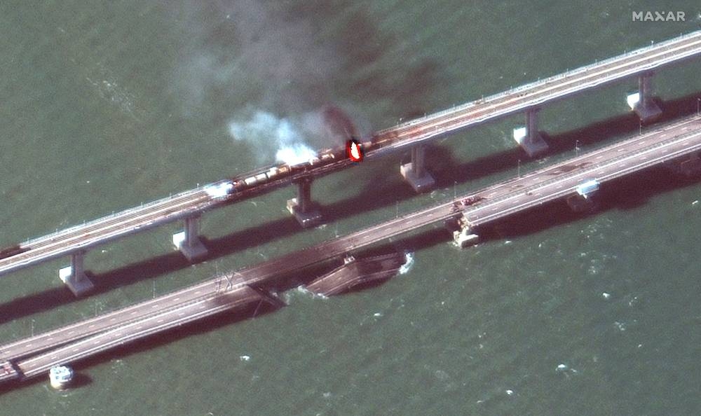 A satellite image shows a close up view of smoke rising from a fire on the Kerch bridge in the Kerch Strait, Crimea, October 8, 2022. — Maxar Technologies/Handout via Reuters