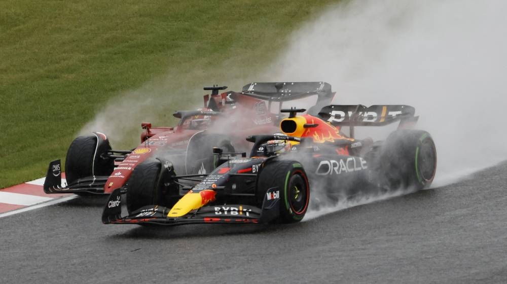 Ferrari's Charles Leclerc and Red Bull's Max Verstappen after the start of the race during the Japanese Grand Prix at the Suzuka Circuit October 9, 2022. — Reuters pic