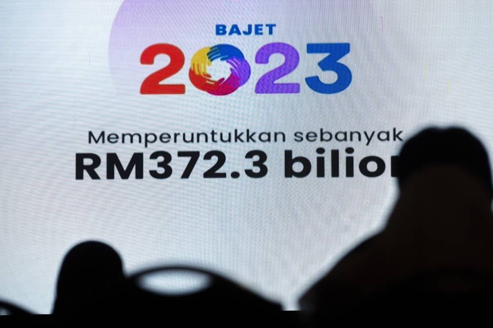 Government servants watch the tabling of Budget 2023 in the Dewan Rakyat, October 7, 2022. Awam today commended the government for its commitment in Budget 2023 to establishing the Tribunal for Anti-Sexual Harassment by early next year. — Picture by Shafwan Zaidon