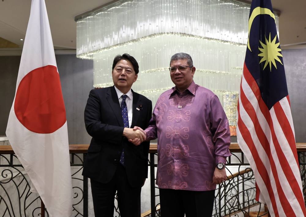 Foreign Minister Datuk Seri Saifuddin Abdullah shakes hands with Japanese Foreign Minister Yoshimasa Hayashi during a joint press conference in Kuala Lumpur October 9, 2022. — Bernama pic
