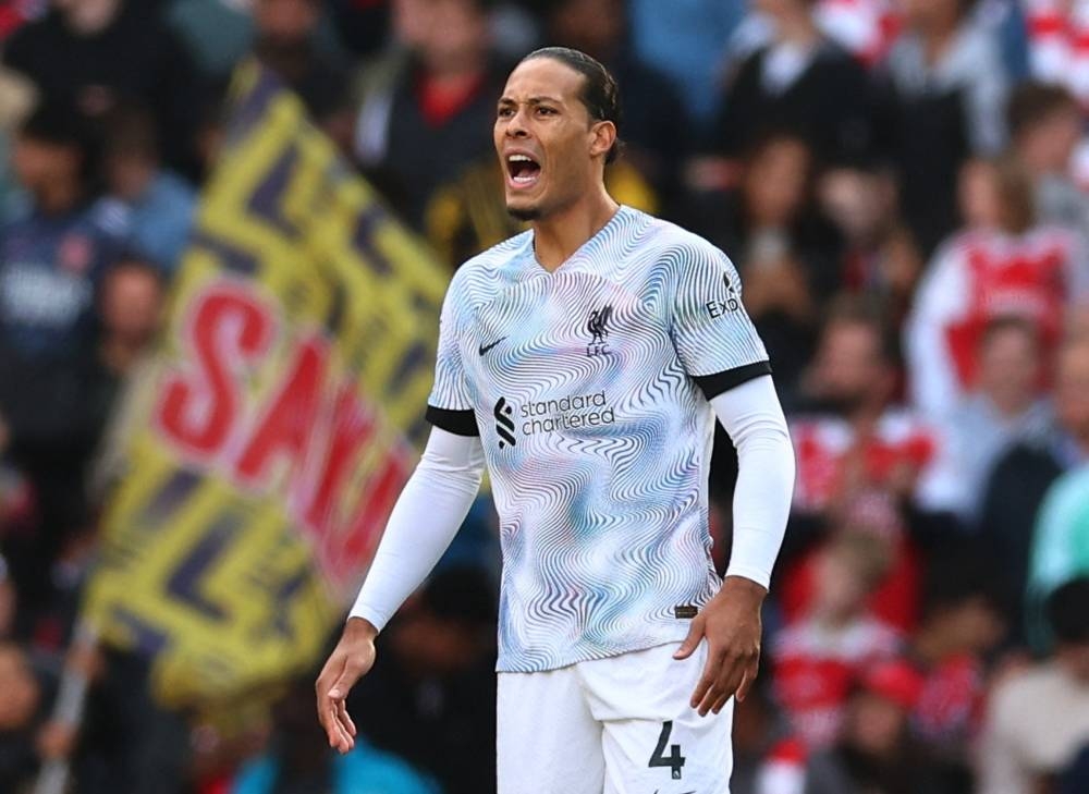 L verpool's Virgil van Dijk reacts after conceding the first goal to Arsenal. — Reuters pic