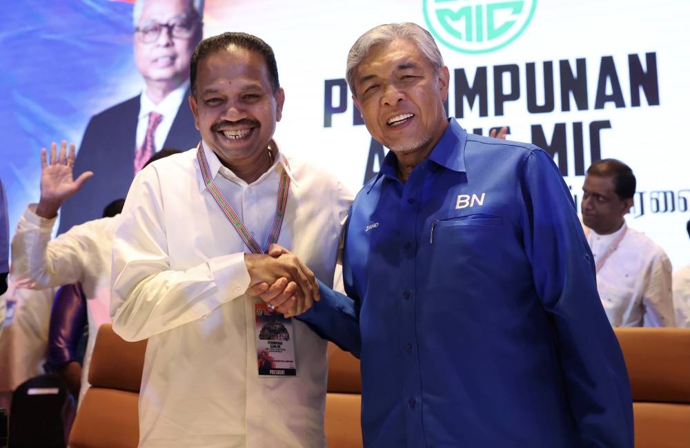 BN chairman Datuk Seri Ahmad Zahid Hamidi with MIC president Tan Sri SA Vigneswaran while attending the 76th MIC General Assembly at the Malaysia International Trade and Exhibition Center (Mitec) in Kuala Lumpur, October 10, 2022. — Bernama pic 