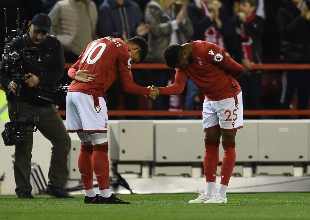 Nottingham Forest's Emmanuel Dennis celebrates scoring their first goal against Aston Villa with Morgan Gibbs-White at The City Ground, Nottingham October 10, 2022. — Reuters pic