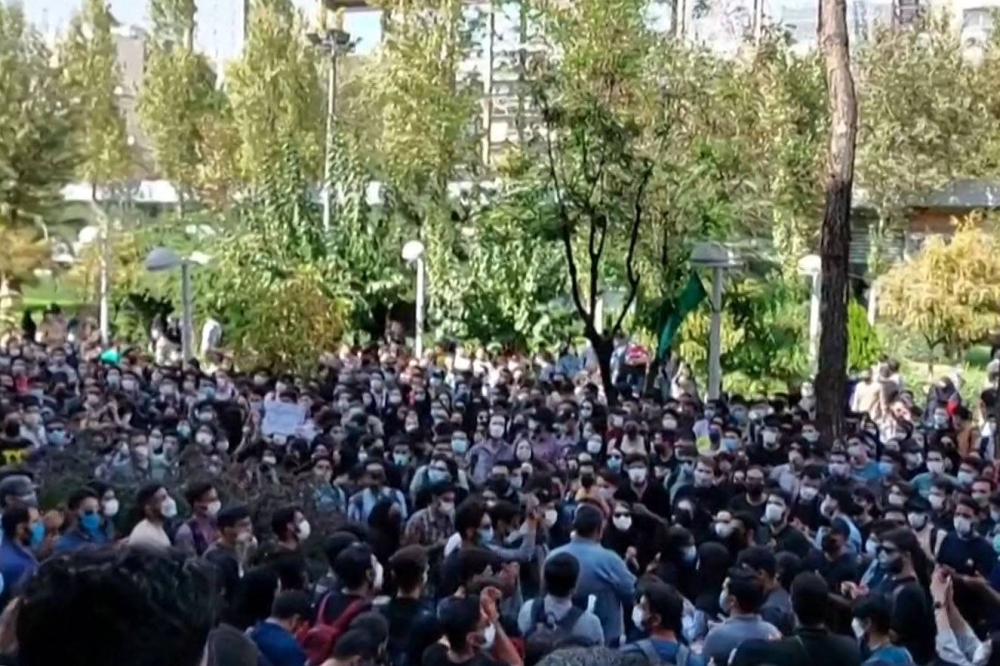 This grab taken from a UGC video made available on the ESN platform on October 10, 2022 shows Iranian students chanting slogans as they protest at Tehran's Amirkabir University of Technology. ― Handout via AFP