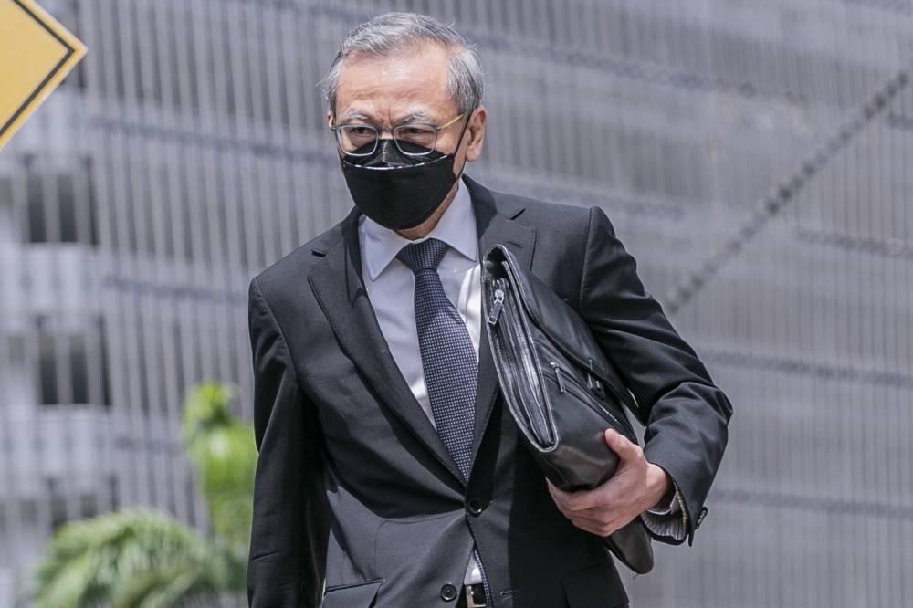 Former managing director AmInvestment Bank Berhad Kok Tuck Cheong leaves the Kuala Lumpur High Court October 11, 2022. — Picture by Hari Anggara