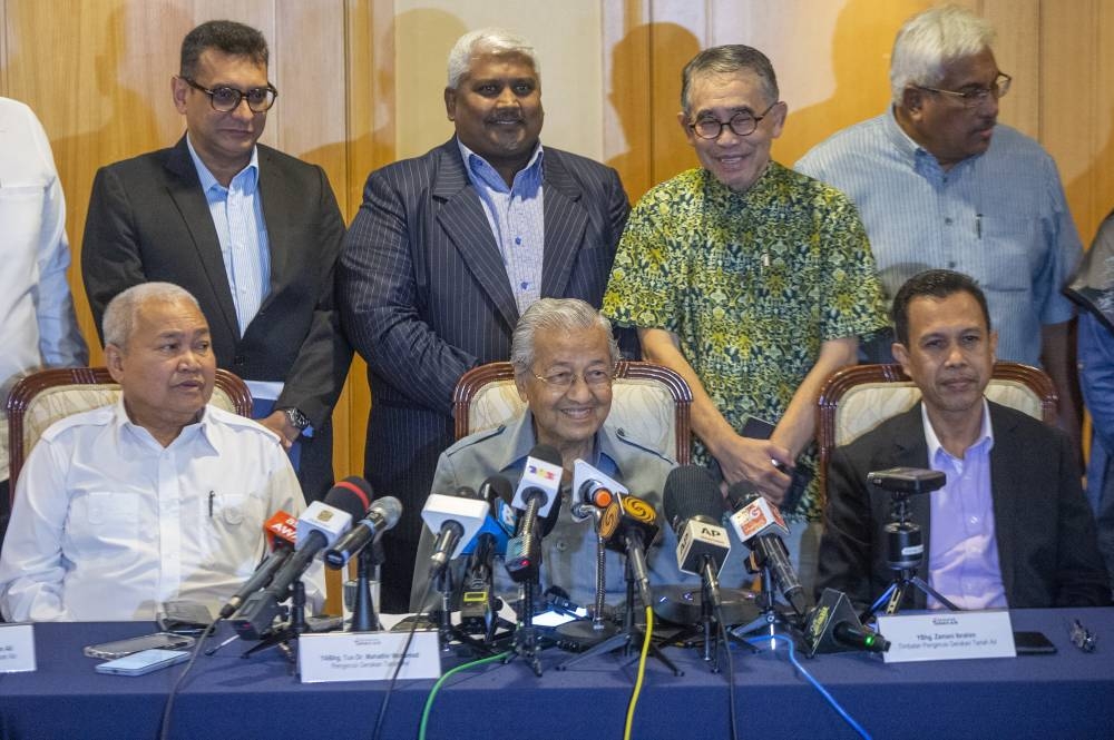 Tun Dr Mahathir Mohammad speaks to the media during a press conference at the Perdana Leadership Foundation October 11, 2022. — Picture Shafwan Zaidon