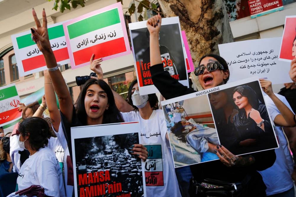 Demonstrators shout slogans during a protest following the death of Mahsa Amini in Iran, near the Iranian consulate in Istanbul, Turkey September 29, 2022. — Reuters pic