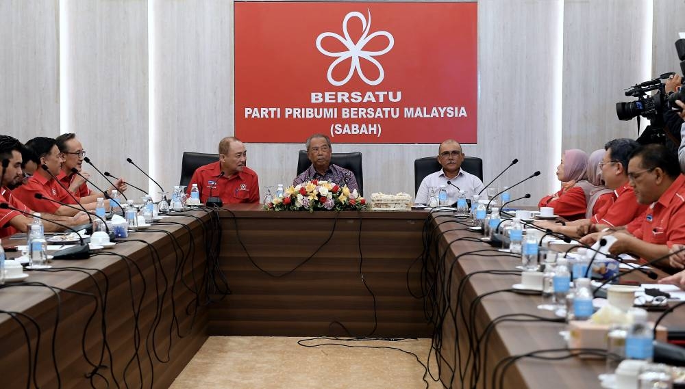 The PN chairman said this meant PAS would remain a key component of PN as a founding member of the coalition. Tan Sri Muhyiddin Yassin with Sabah Chief Minister and state Parti Pribumi Bersatu Malaysia chairman Datuk Hajiji Noor and Bersatu vice-president Datuk Seri Ronald Kiandee at the Sabah Bersatu office, Alamesra, Kota Kinabalu, October 11, 2022. — Bernama pic