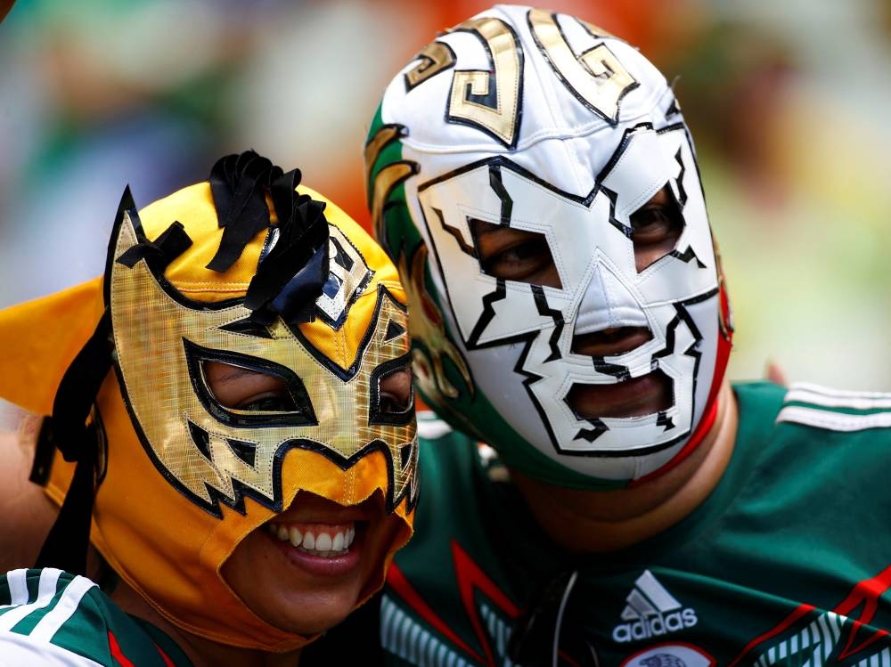 Fans of Mexico wearing Mexican lucha libre wrestling masks are pictured before their 2014 World Cup round of 16 game against the Netherlands at the Castelao arena in Fortaleza June 29, 2014. — Reuters pic