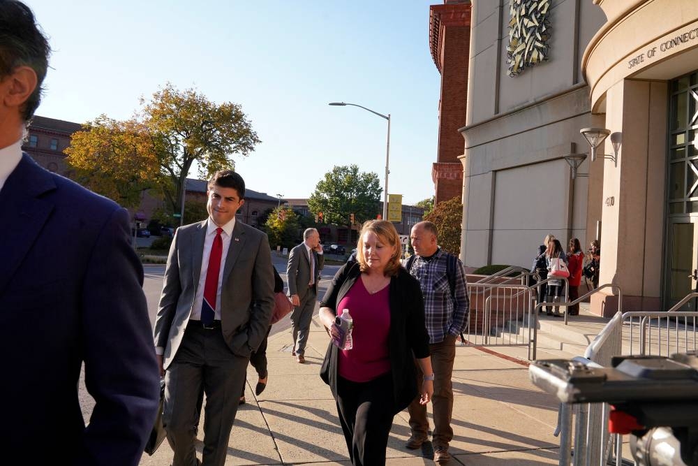 Attorneys and family members leave the courthouse at the end of day three of jury deliberations as Alex Jones faces a second defamation trial over Sandy Hook claims in Waterbury, Connecticut, US October 11, 2022. ― Reuters pic