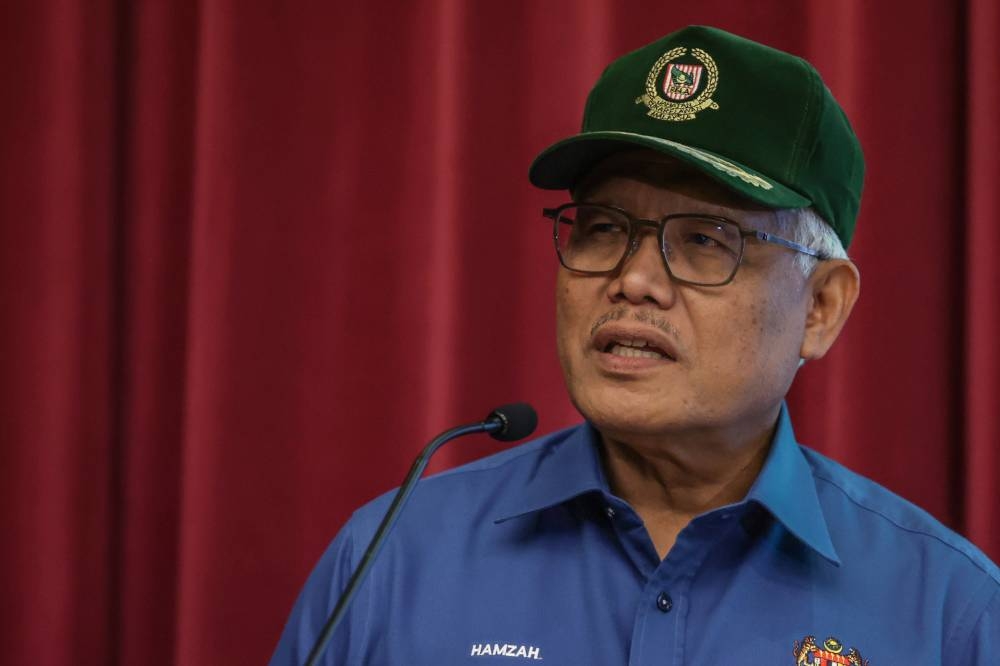 Home Minister Datuk Seri Hamzah Zainudin speaks during a special media conference on flood operations in Bukit Aman, Kuala Lumpur October 12, 2022. — Bernama pic
