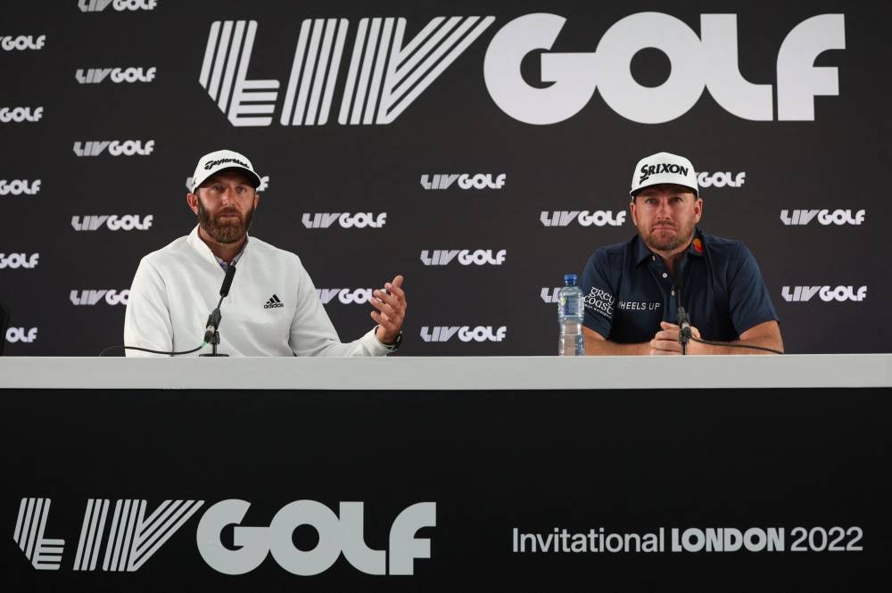 Dustin Johnson (left) of the US and Northern Ireland’s Graeme McDowell during a press conference at the Centurion Club, Hemel Hempstead, Britain June 7, 2022. — Reuters pic