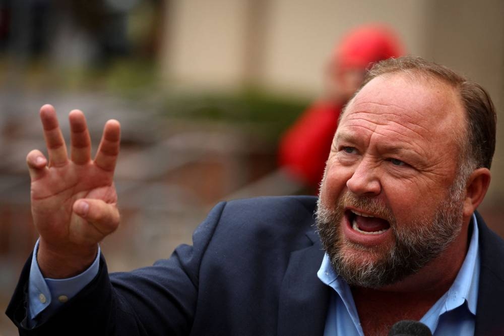 Alex Jones claimed for years that the massacre was staged by the government as part of a plot to take away Americans' guns. — Reuters pic