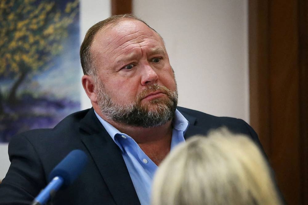 Alex Jones, founder of the Infowars radio show and webcast, has been ordered to pay nearly US$1 billion in damages. — Reuters pic