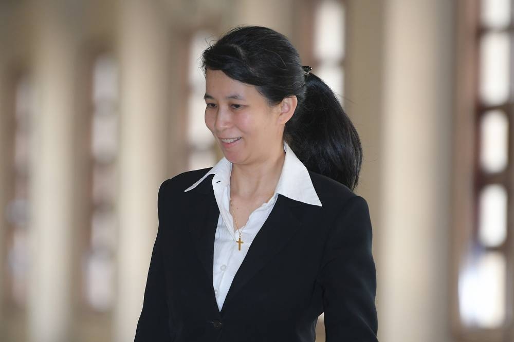 This July 2019 file photograph shows former AmBank relationship manager Joanna Yu Ging Ping arriving at Kuala Lumpur Court Complex. — Picture by Mukhriz Hazim