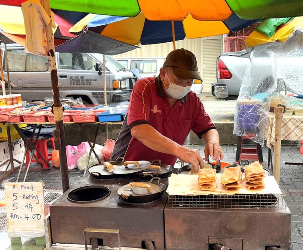 Find Wong who runs this 'apom' stall every Sunday here. — Pictures by Lee Khang Yi