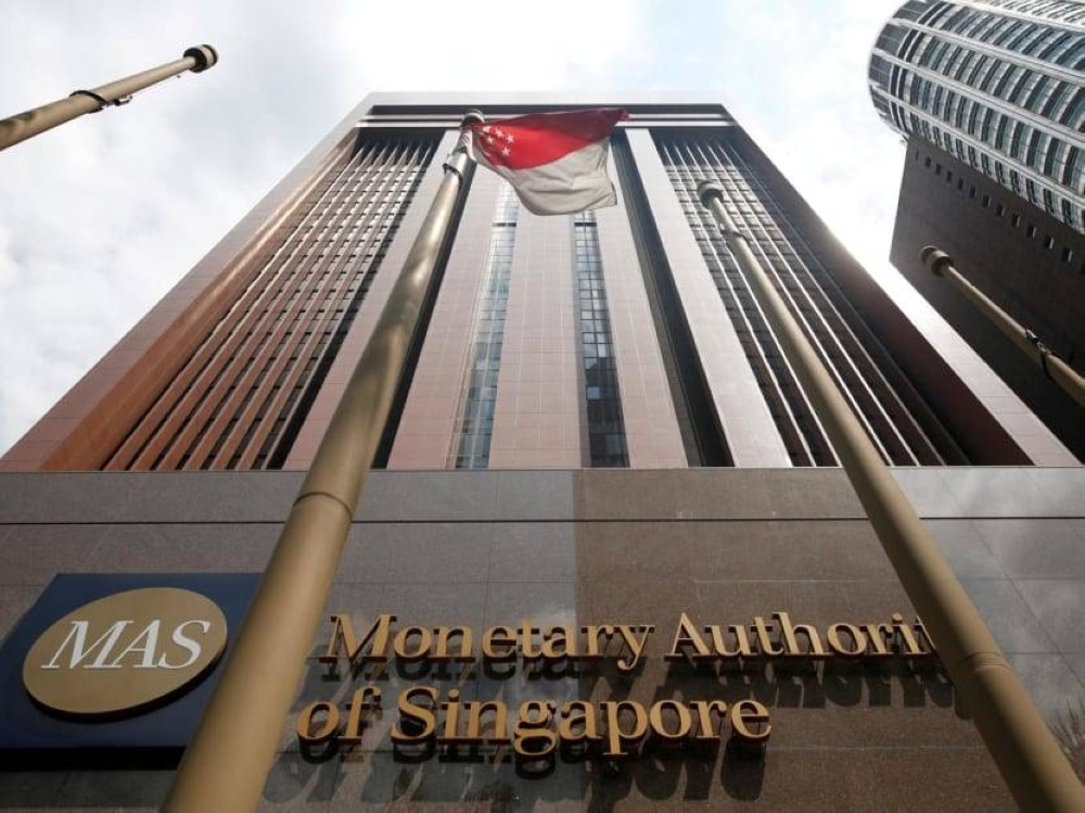 The Monetary Authority of Singapore says that it will re-centre the midpoint of its Singapore dollar nominal effective exchange rate (S$NEER) policy band ‘up to its prevailing level’, while maintaining the slope and width of the band. ― Reuters pic