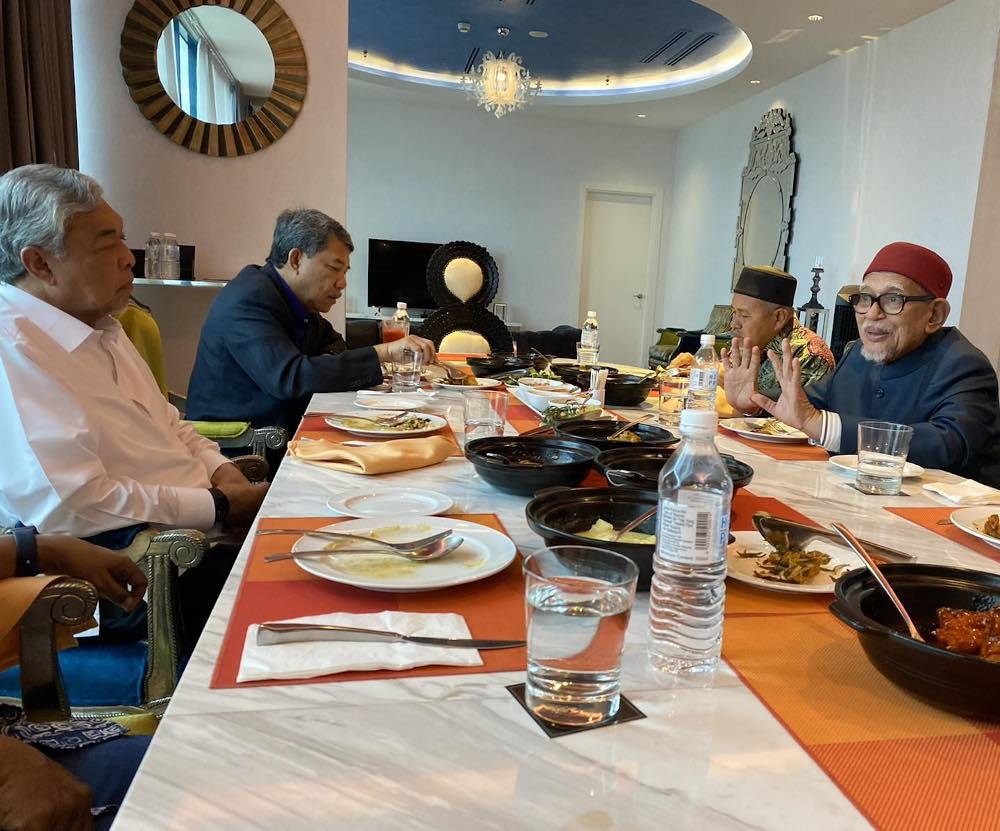 Umno president Datuk Seri Ahmad Zahid Hamidi and and deputy president Datuk Seri Mohamad Hasan are seen in a meeting with their PAS counterparts Tan Sri Abdul Hadi Awang and Datuk Seri Tuan Ibrahim Tuan Man October 14, 2022. — Picture via Facebook/Dr Asyraf Wajdi Dusuki 