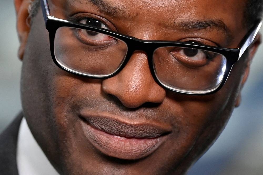 Sterling sank more than one per cent to under US$1.12 after Truss dismissed Kwarteng (pic). — Reuters pic