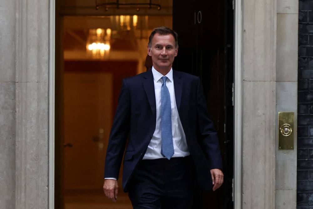 New Chancellor of the Exchequer Jeremy Hunt leaves 10 Downing Street in London, Britain, October 14, 2022. ― Reuters pic