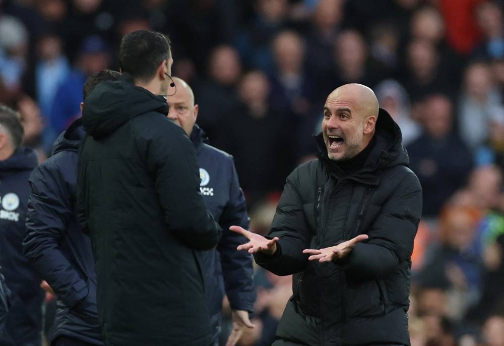 Manchester City manager Pep Guardiola remonstrates with the fourth official during the match against Liverpool at Anfield, Liverpool October 16, 2022. — Reuters pic