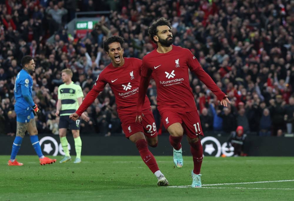 Liverpool's Mohamed Salah celebrates scoring their first goal against Manchester City with Fabio Carvalho at Anfield, Liverpool October 16, 2022. — Reuters pic