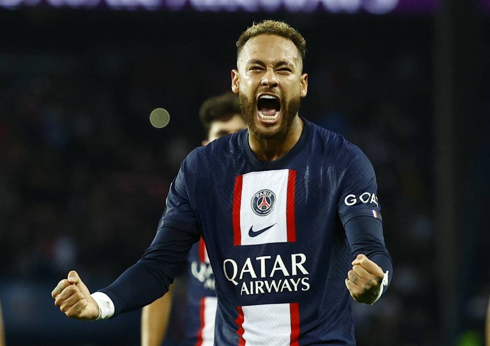 Paris St Germain's Neymar celebrates scoring their first goal against Olympique de Marseille at the Parc des Princes, Paris October 16, 2022. — Reuters pic