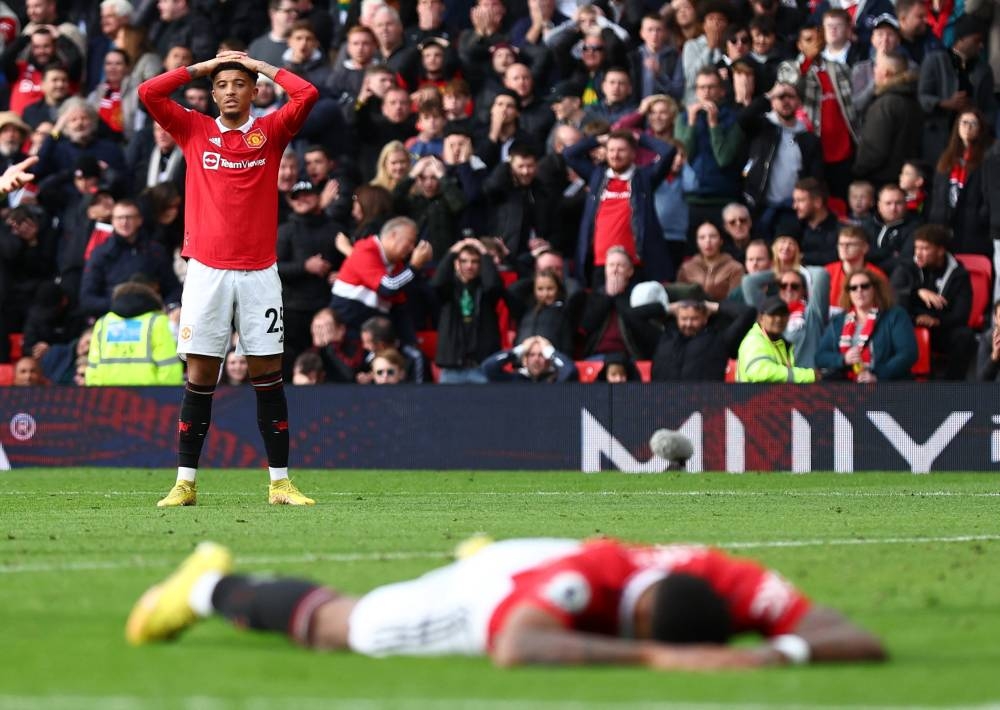  Manchester United's Jadon Sancho reacts after Marcus Rashford misses a chance to score against Newcastle United at Old Trafford, Manchester October 16, 2022. — Reuters pic