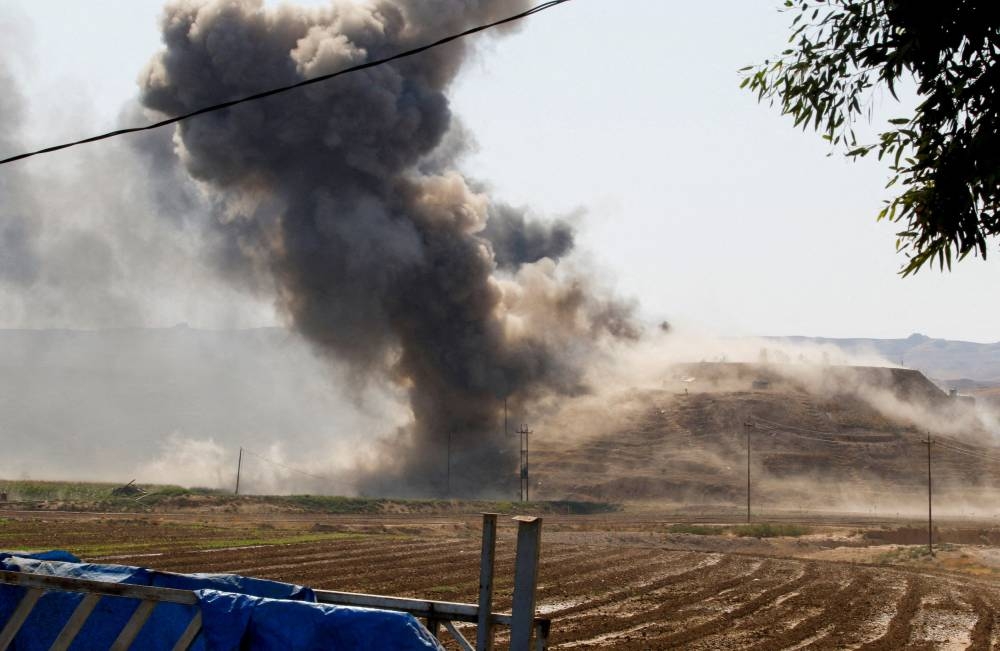 Smoke rises from the Iraqi Kurdistan headquarters of the Kurdistan Freedom Party (PAK), after Iran's Revolutionary Guards' strike on the outskirts of Kirkuk September 28, 2022. — Reuters pic