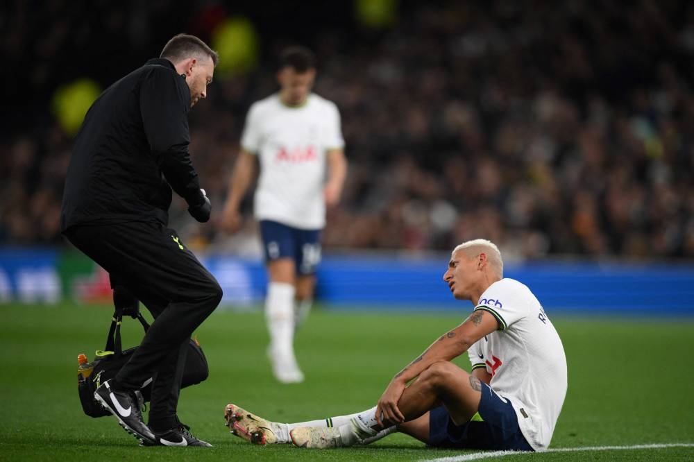 Tottenham Hotspur striker Richarlison reacts as he receives medical attention during the English Premier League match between Tottenham Hotspur and Everton at Tottenham Hotspur Stadium in London, October 15, 2022. — AFP pic 