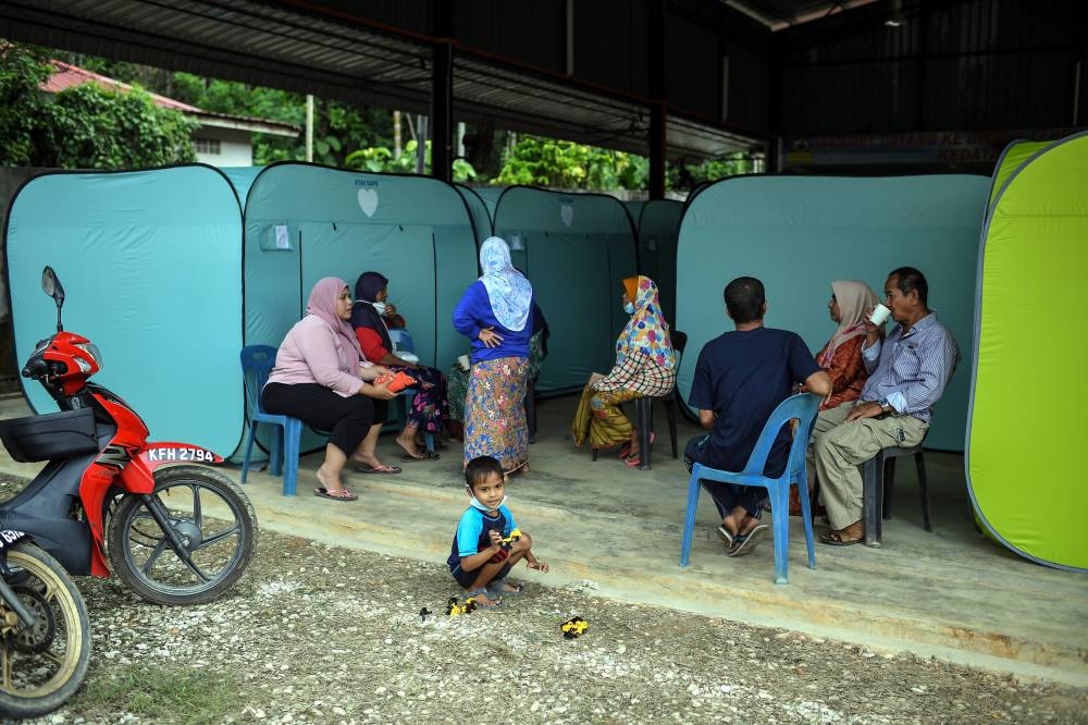 File picture of flood evacuees at a temporary flood relief centre in Baling, Kedah, July 29, 2022. — Bernama pic