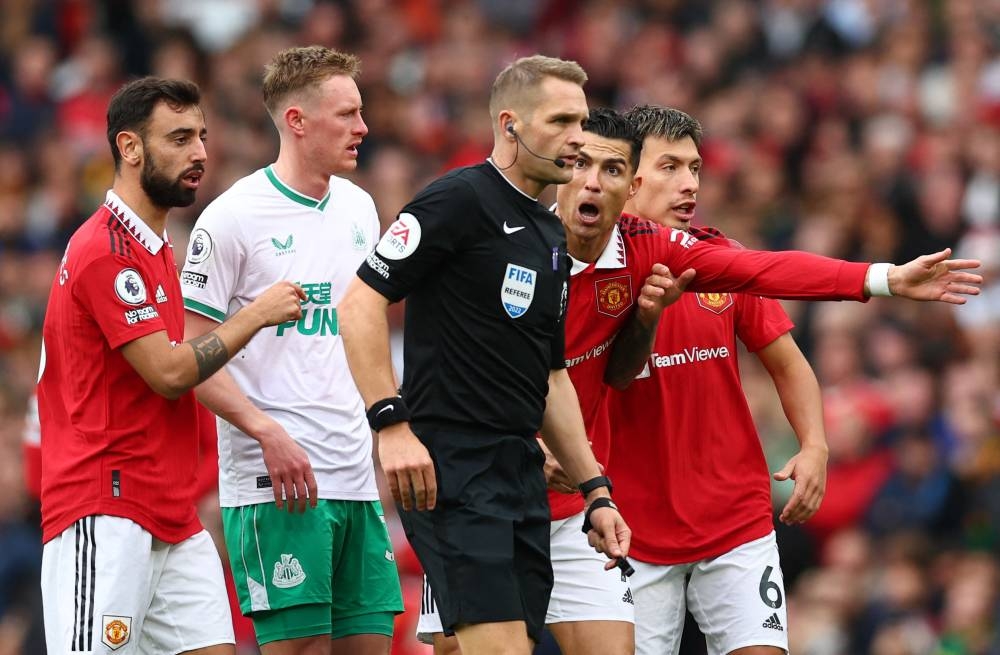 Manchester United's Cristiano Ronaldo reacts before he is shown a yellow card by referee Craig Pawson during the match against Newcastle United at Old Trafford, Manchester October 16, 2022. — Reuters pic