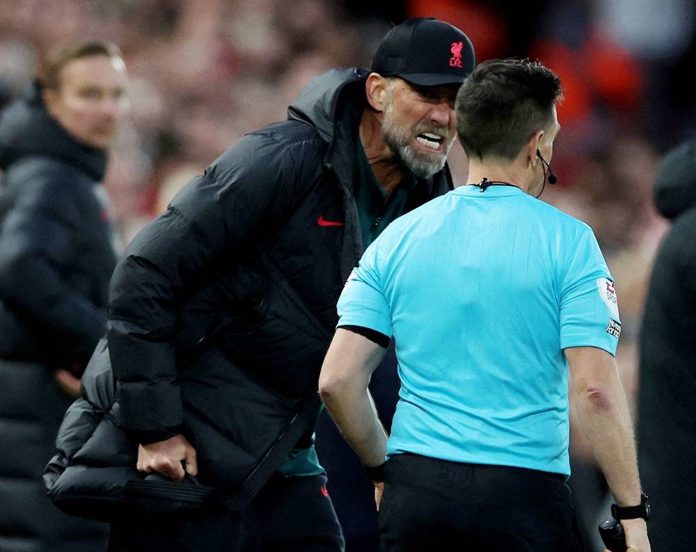 Liverpool manager Juergen Klopp remonstrates with the assistant referee during the match against Manchester City at Anfield, Liverpool October 16, 2022. — Reuters pic