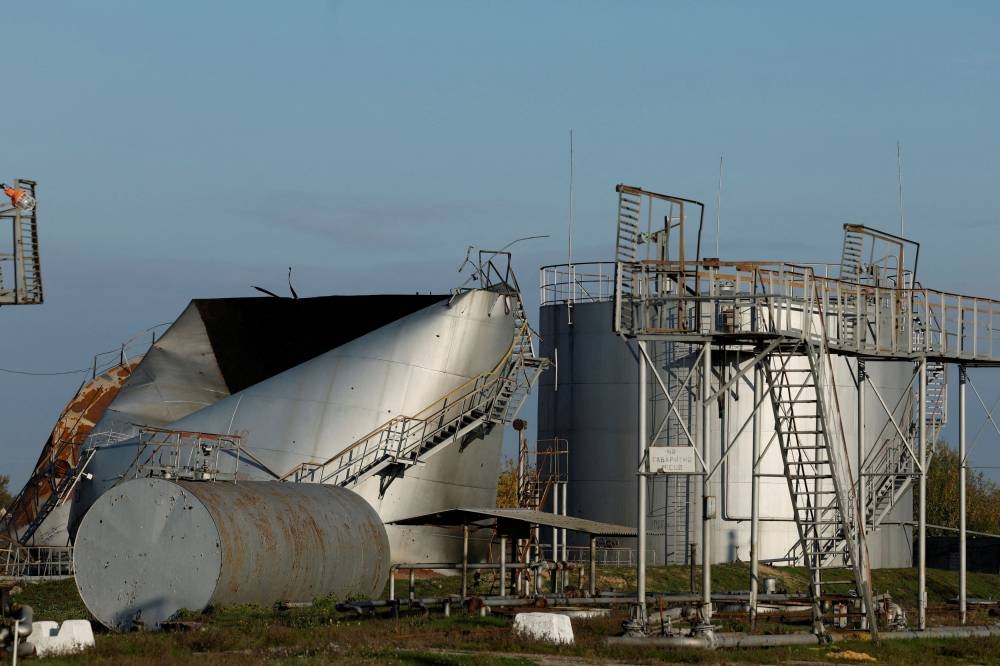 Fuel tanks are seen damaged by Russian strikes, amid Russia's attack on Ukraine, in the recently retaken town of Kupiansk, Ukraine October 18, 2022. ― Reuters pic