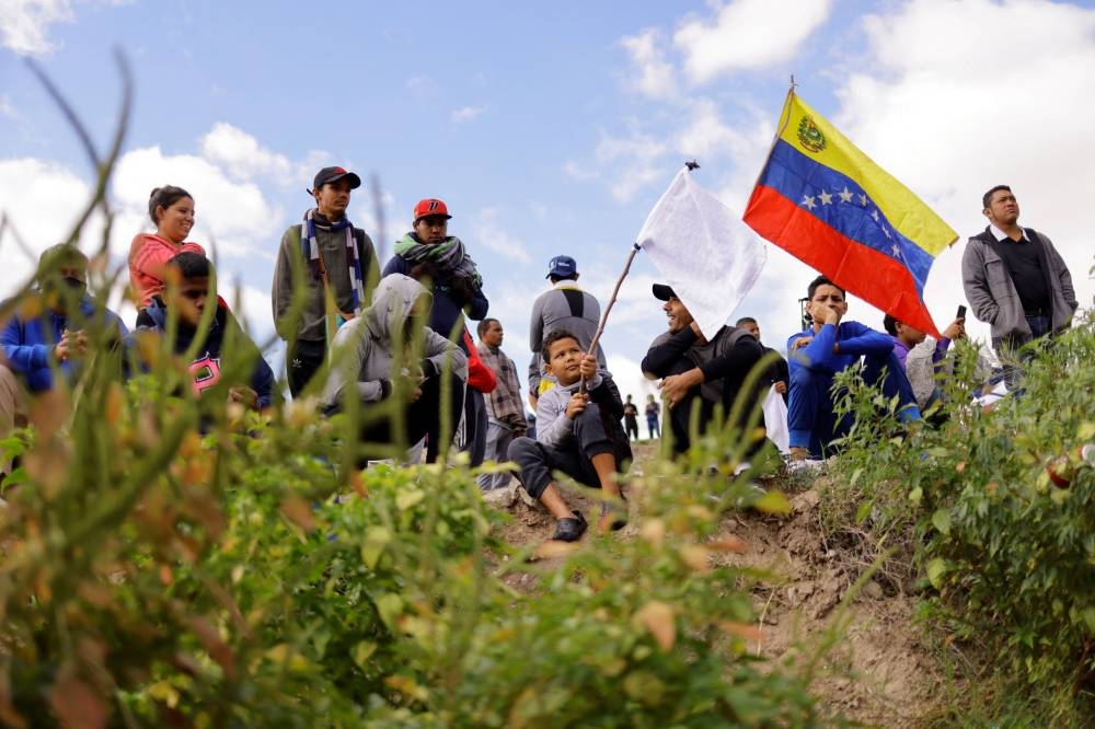 Venezuelan migrants, some expelled from the US to Mexico under Title 42 and others who have not crossed yet, protest new immigration policies on the banks of the Rio Bravo river, in Ciudad Juarez, Mexico October 18, 2022. ― Reuters pic
