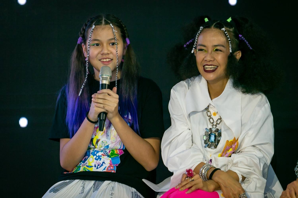Looi (right) worked with daughter Maya to create runway looks incorporating doodle art and traditional weaving. — Picture by Devan Manuel