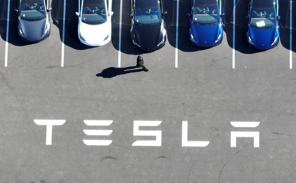 Brand new Tesla cars sit in a parking lot at the Tesla factory in Fremont, California October 19, 2022. — AFP pic 