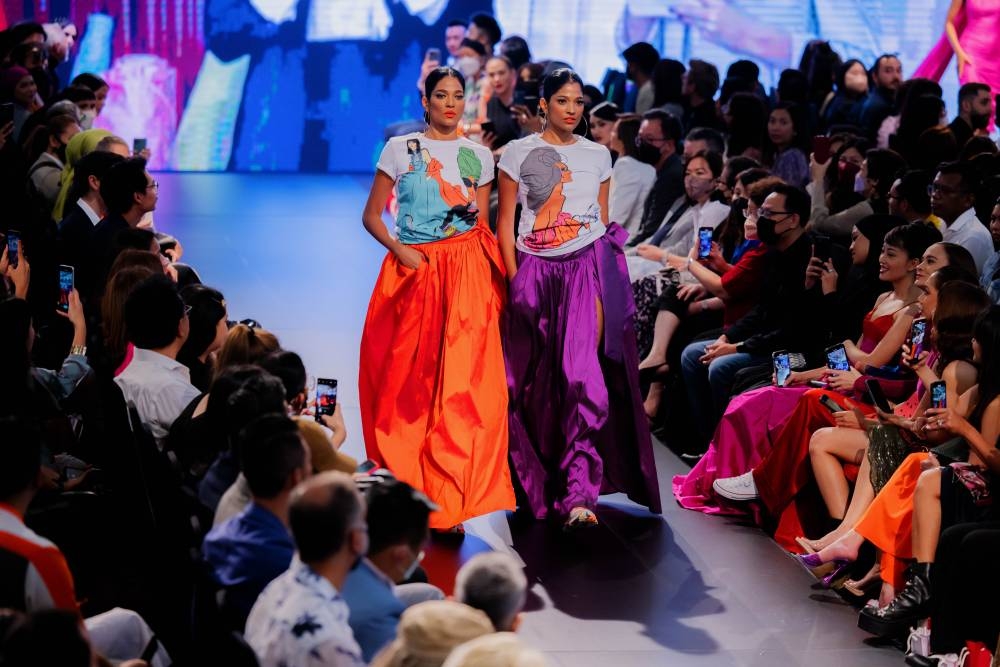 Twin sisters Thanuja Ananthan and Anuja Ananthan in Syomir's bright coloured statement skirts. — Picture courtesy of All is Amazing Photography