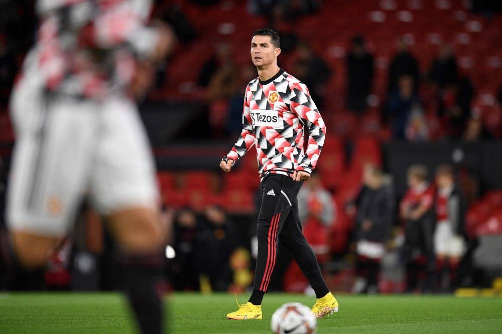 Manchester United striker Cristiano Ronaldo reacts during the warm up prior to the English Premier League football match between Manchester United and Tottenham Hotspur at Old Trafford in Manchester, October 19, 2022. — AFP pic 